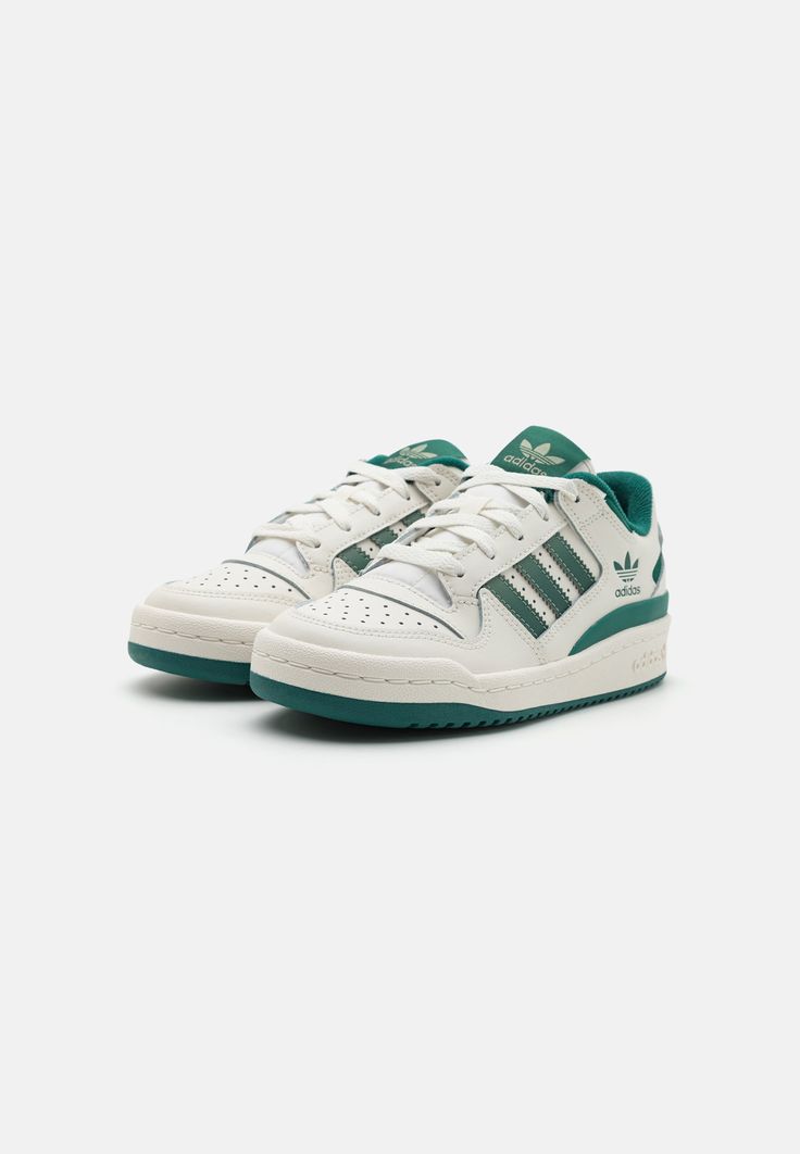 Close-up of the Adidas Forum Low Green and White, showcasing its smooth leather upper, perforated toe box, and classic Velcro strap.