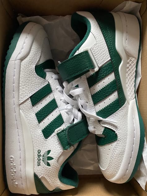 Side profile of the Adidas Forum Low Green and White, highlighting its vibrant green overlays, Three Stripes branding, and cushioned midsole.