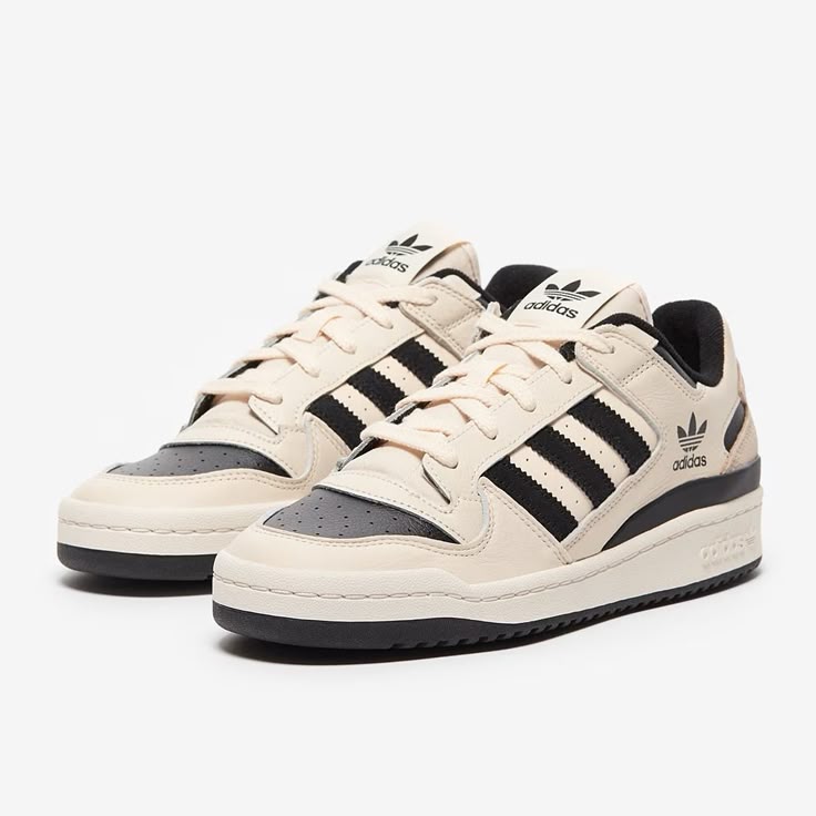 Close-up of the Adidas Forum Low White and Black, showcasing its premium leather upper, perforated toe box, and Velcro strap.
