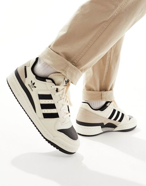 Adidas Forum Low White and Black worn on feet, emphasizing its vintage basketball look, comfortable fit, and everyday versatility.