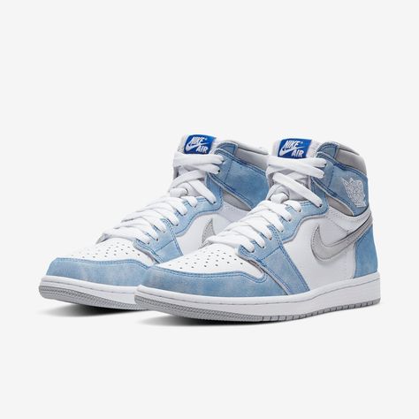 Close-up of the Air Jordan 1 "Hyper Royal," showcasing its soft blue suede overlays, white leather base, and perforated toe box.