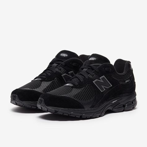 Close-up of the New Balance 2002R Black, showcasing its premium suede and mesh upper with breathable detailing.