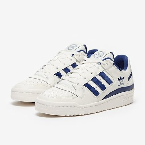 Close-up of the Adidas Forum Low Blue and White, showcasing its smooth leather upper, perforated toe box, and secure Velcro strap.

