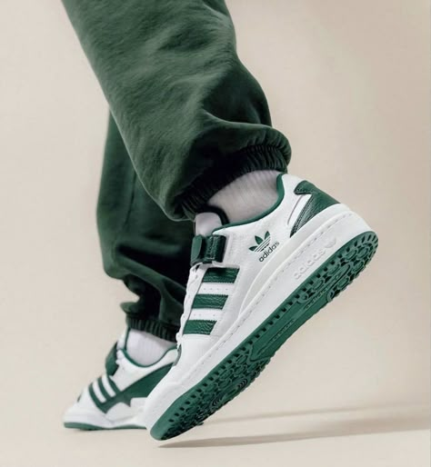 Adidas Forum Low Green and White worn on feet, emphasizing its retro basketball style, comfortable fit, and everyday versatility.

