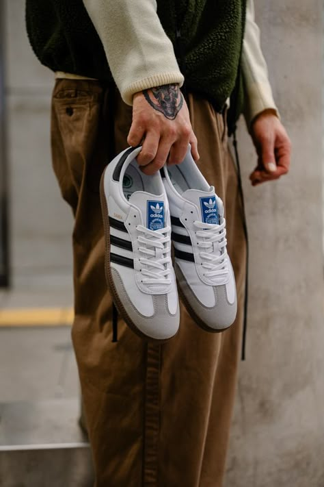 Adidas Samba OG Black and White worn on feet, emphasizing its stylish versatility, comfortable fit, and everyday wearability.

