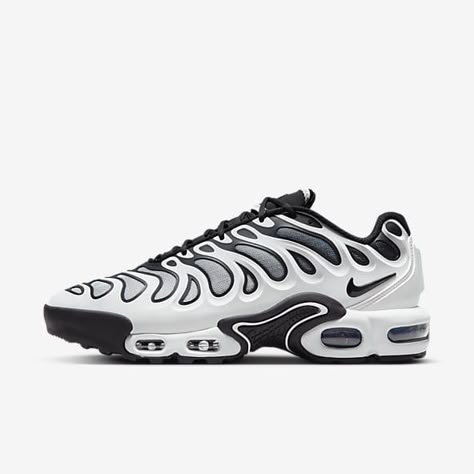 Side profile of the Nike Air Max Plus Black and White Drift, highlighting its Tuned Air cushioning, durable rubber outsole, and sleek design.

