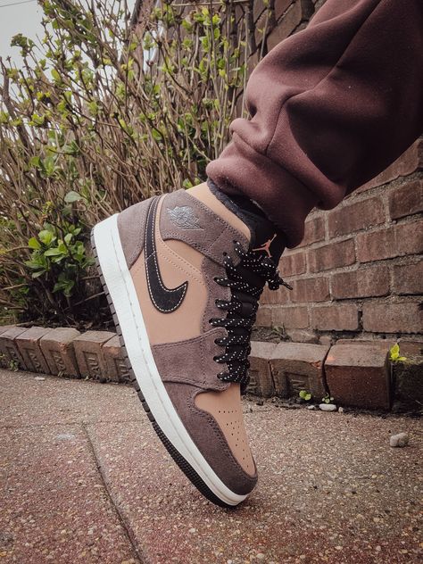 Air Jordan 1 "Dark Chocolate" worn on feet, emphasizing its earthy tones, premium materials, and everyday wearability.

