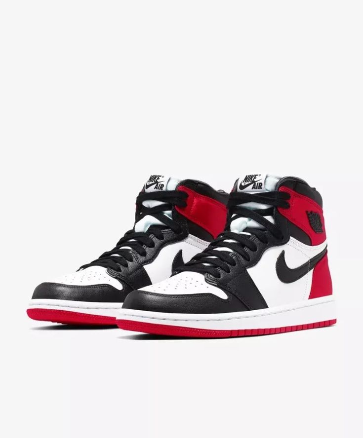 Close-up of the Jordan 1 Retro High Satin 'Black Toe,' showcasing its premium leather upper, satin heel, and bold black, white, and red design.

