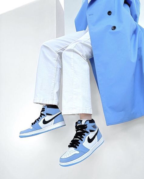 Jordan 1 Retro High Blue "UNC" worn on feet, emphasizing its timeless style, premium materials, and basketball heritage.

