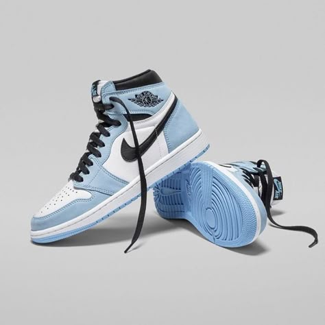 Side profile of the Jordan 1 Retro High Blue "UNC," highlighting its Carolina blue overlays, Nike Swoosh, and Air Jordan Wings logo.

