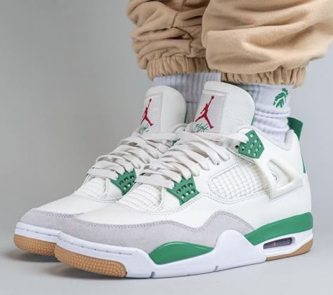 Jordan 4 "Pine Green" Retro worn on feet, emphasizing its stylish contrast, premium materials, and everyday versatility.

