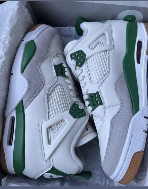 Side profile of the Jordan 4 "Pine Green" Retro, highlighting its green accents, white midsole, and iconic Jumpman logo on the heel.

