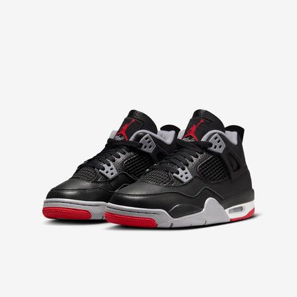 Close-up of the Jordan 4 Red and Black Reimagined, showcasing its premium leather upper, breathable mesh, and classic lace cage.

