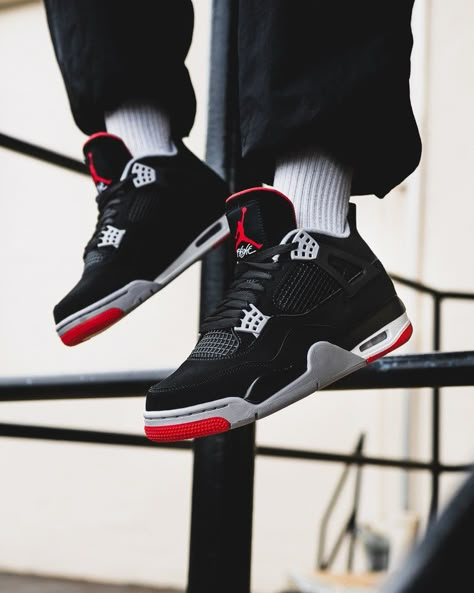 Jordan 4 Red and Black Reimagined worn on feet, emphasizing its retro appeal, premium build, and everyday comfort.

