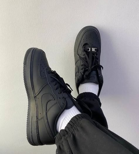 Nike Air Force 1 Black worn on feet, emphasizing its clean, all-black aesthetic, comfort, and everyday versatility.

