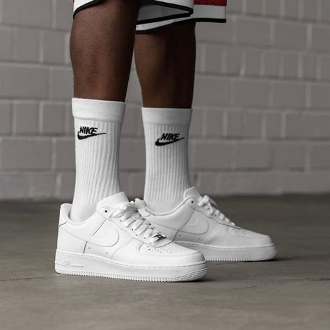 Nike Air Force 1 White worn on feet, demonstrating its stylish versatility and classic streetwear appeal.