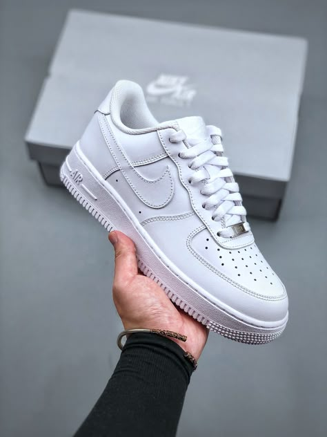 White, highlighting the clean, all-white silhouette and iconic Nike Swoosh.