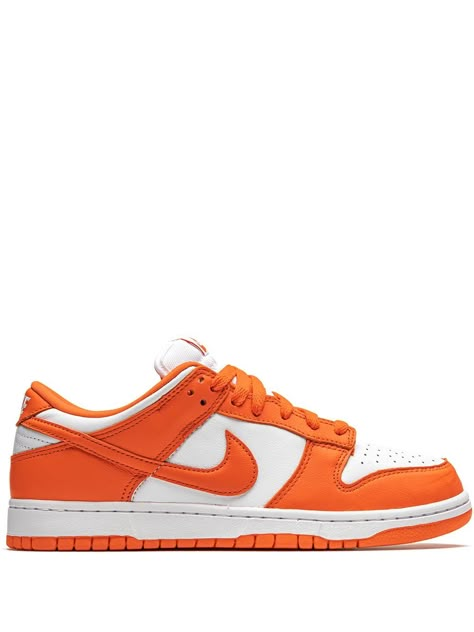 Side profile of the Nike Dunk Low Orange, highlighting its bright color contrast, signature Nike Swoosh, and sleek low-top silhouette.