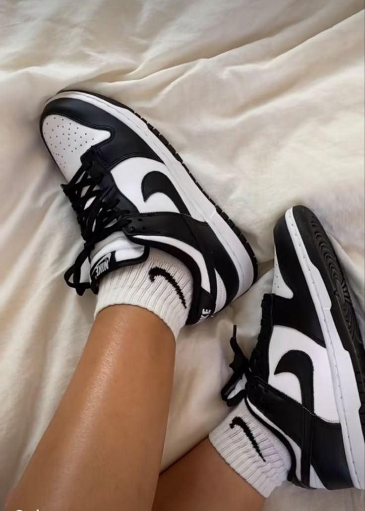 Side profile of the Nike Dunk Low Panda, highlighting its bold contrast design and classic Nike Swoosh.