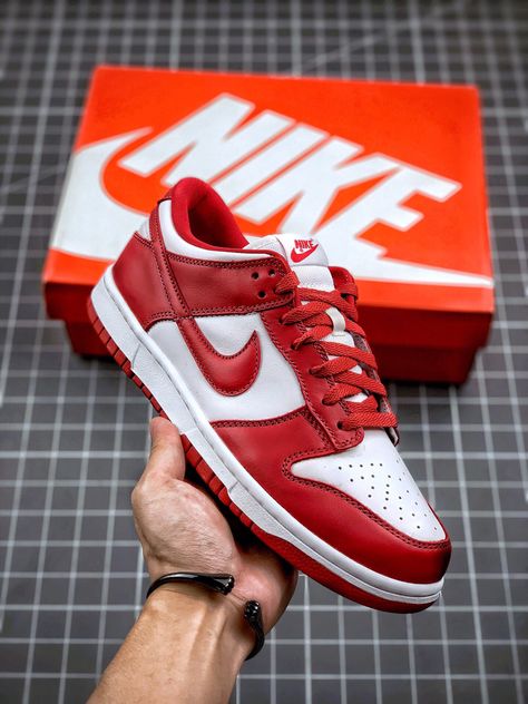 Side profile of the Nike Dunk Low Red, showcasing its bold color contrast, Nike Swoosh, and sleek low-top design